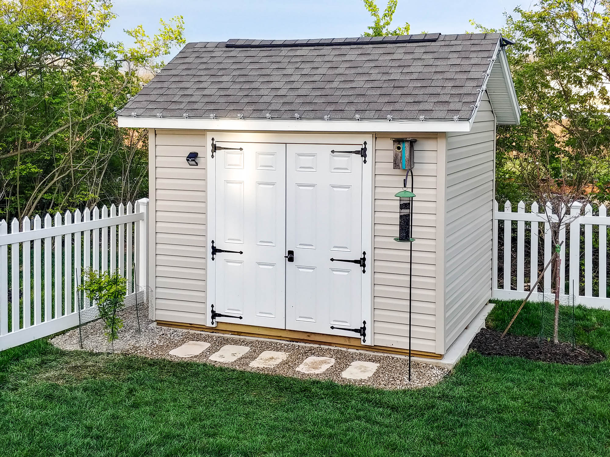 Interior view of a shed roof with exposed wooden beams and bright white paneling. Depending on your location, you may or may not need shed permits in Ohio.