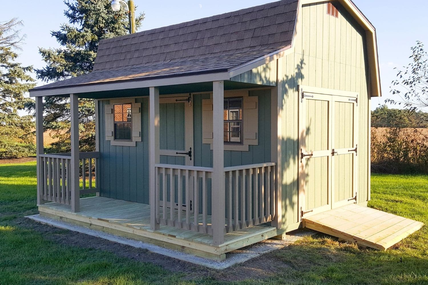 green prebuilt cabins with porch